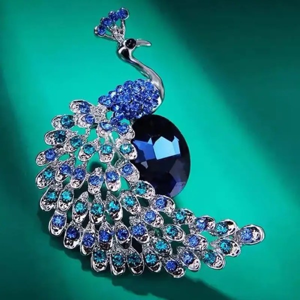 bijou doxa en forme de paon bleu