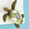 broche dorée shelly en forme de tortue
