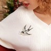 broche oiseau orel avec brindille