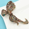 Accessoire mode rétro : broche nœud style ancien idéale pour accessoiriser un manteau ou une écharpe