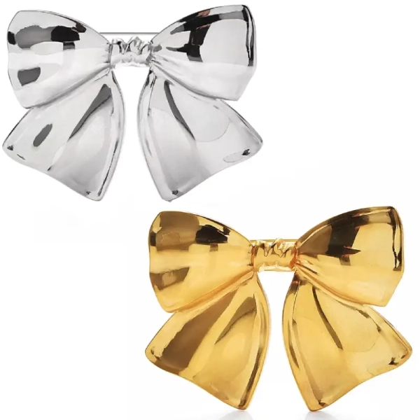 Broche fantaisie forme nœud ruban en métal lisse doré ou argenté effet miroir modèle Sasha