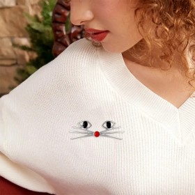 broche épurée d'un chat avec ses moustaches