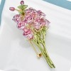 broche en forme de bouquet de roses poudrées viva