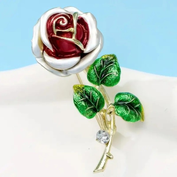 broche rose rouge hope feuilles vertes